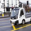 X-Cell Road Legal Electric Utility Vehicle passing through traffic lights
