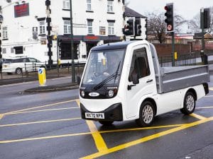 X-Cell Road Legal Electric Utility Vehicle passing through traffic lights