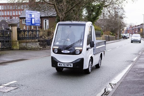 White X-Cell Road Legal Electric Utility Vehicle On Road