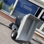 EP Electro Barrow tipping in front of ePowerTrucks office thumbnail